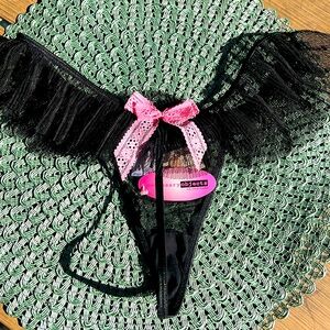 NWT Size large black thong with pink bow 🎀 on back with ruffle.